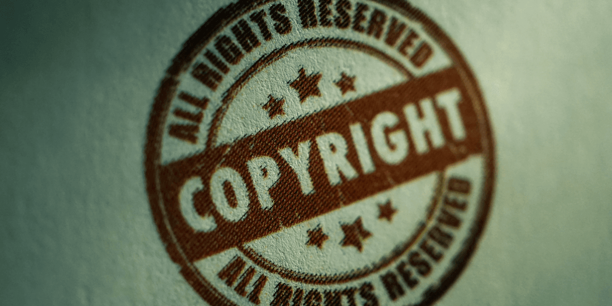 A brown copyright stamp with stars and the text "ALL RIGHTS RESERVED"