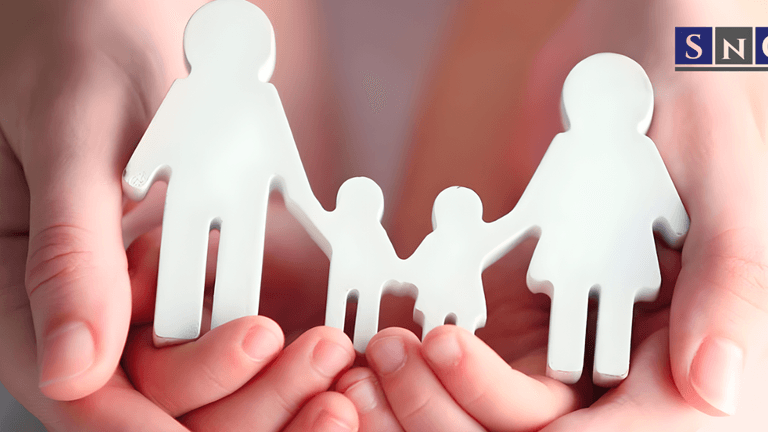 Hands holding paper cutout family figures symbolizing care, unity, and support for legal name change services in California.