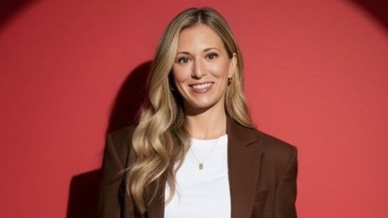 Professional portrait of Jaime Weiland smiling against a red background, highlighting her healthcare education and consulting work.