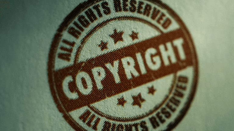 A brown copyright stamp with stars and the text "ALL RIGHTS RESERVED"
