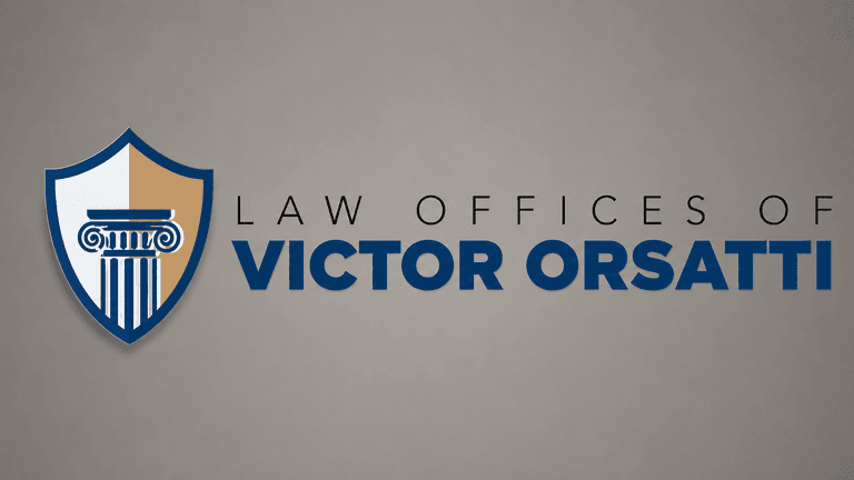 Law firm logo with shield, courthouse column icon, and “Law Offices of Victor Orsatti” text.